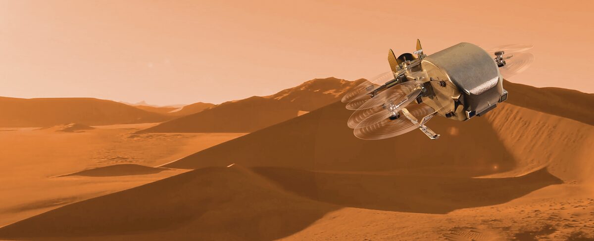 Artist's concept of the Dragonfly dual-quadcopter hovering over the organic-rich dunes of Saturn's moon Titan.