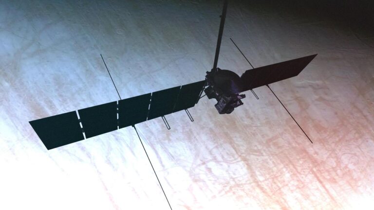 Europa Clipper spacecraft flying over Europa surface in artist concept illustration