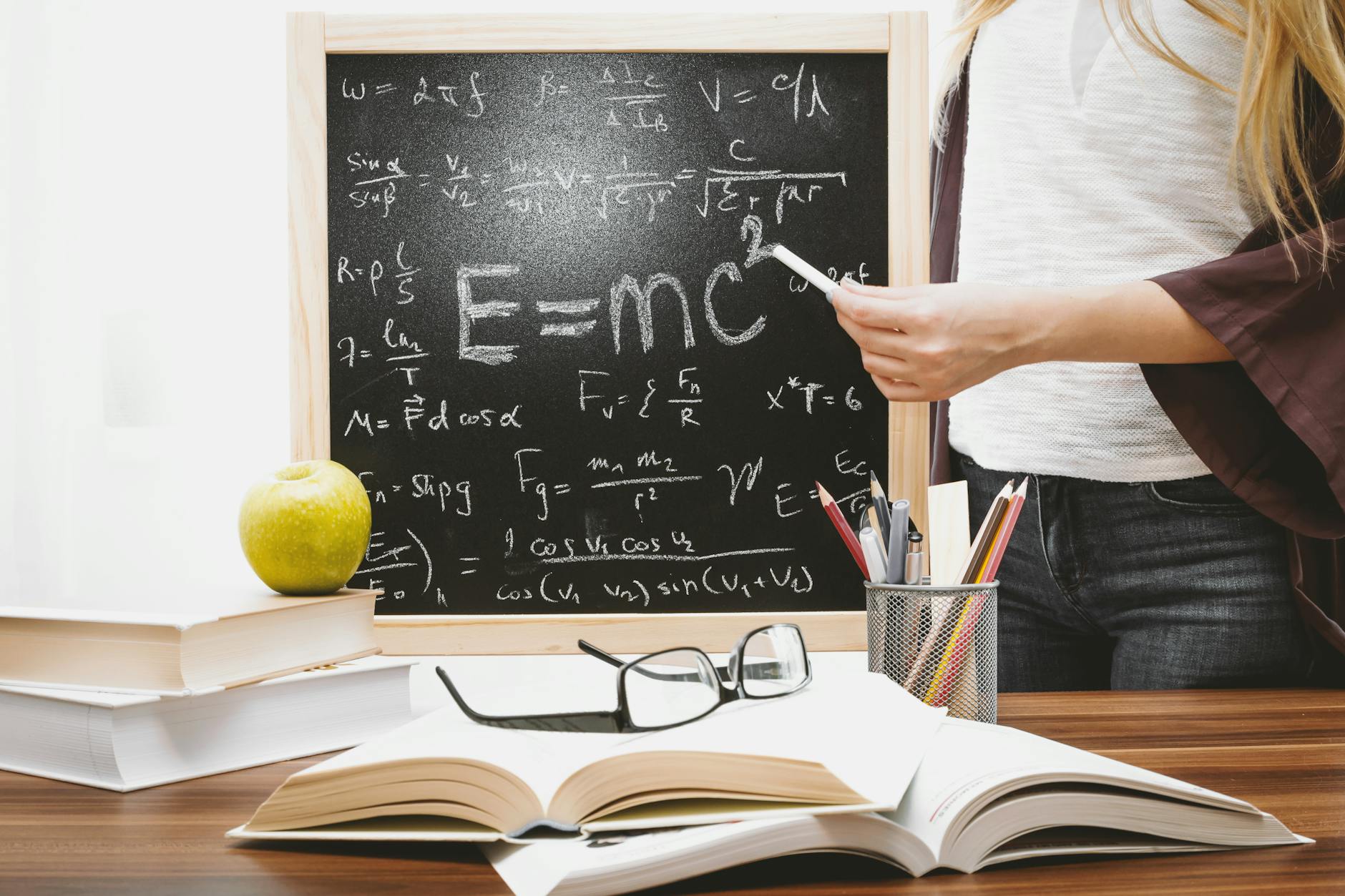 Albert Einstein at a blackboard representing his special relativity theory that established the speed of light as a fundamental constant