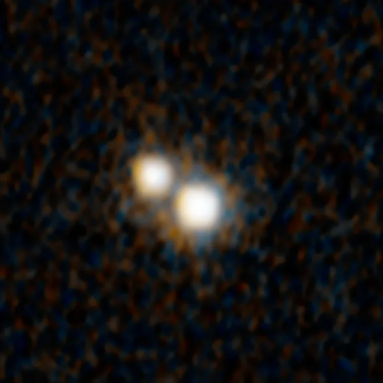 Hubble Space Telescope image of double quasar J0749+2255 — two quasars in merging galaxies when the universe was just 3 billion years old