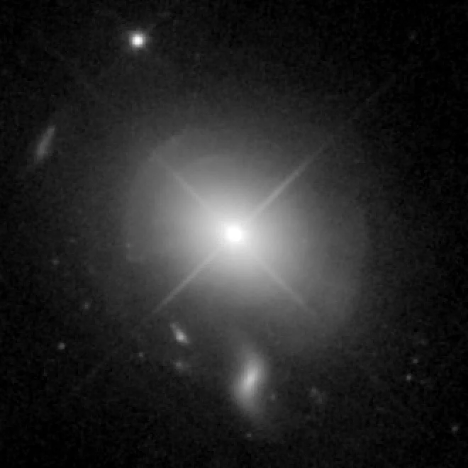 Hubble Space Telescope image of quasar MC2 1635+119 embedded in an elliptical host galaxy showing signs of a recent galactic merger