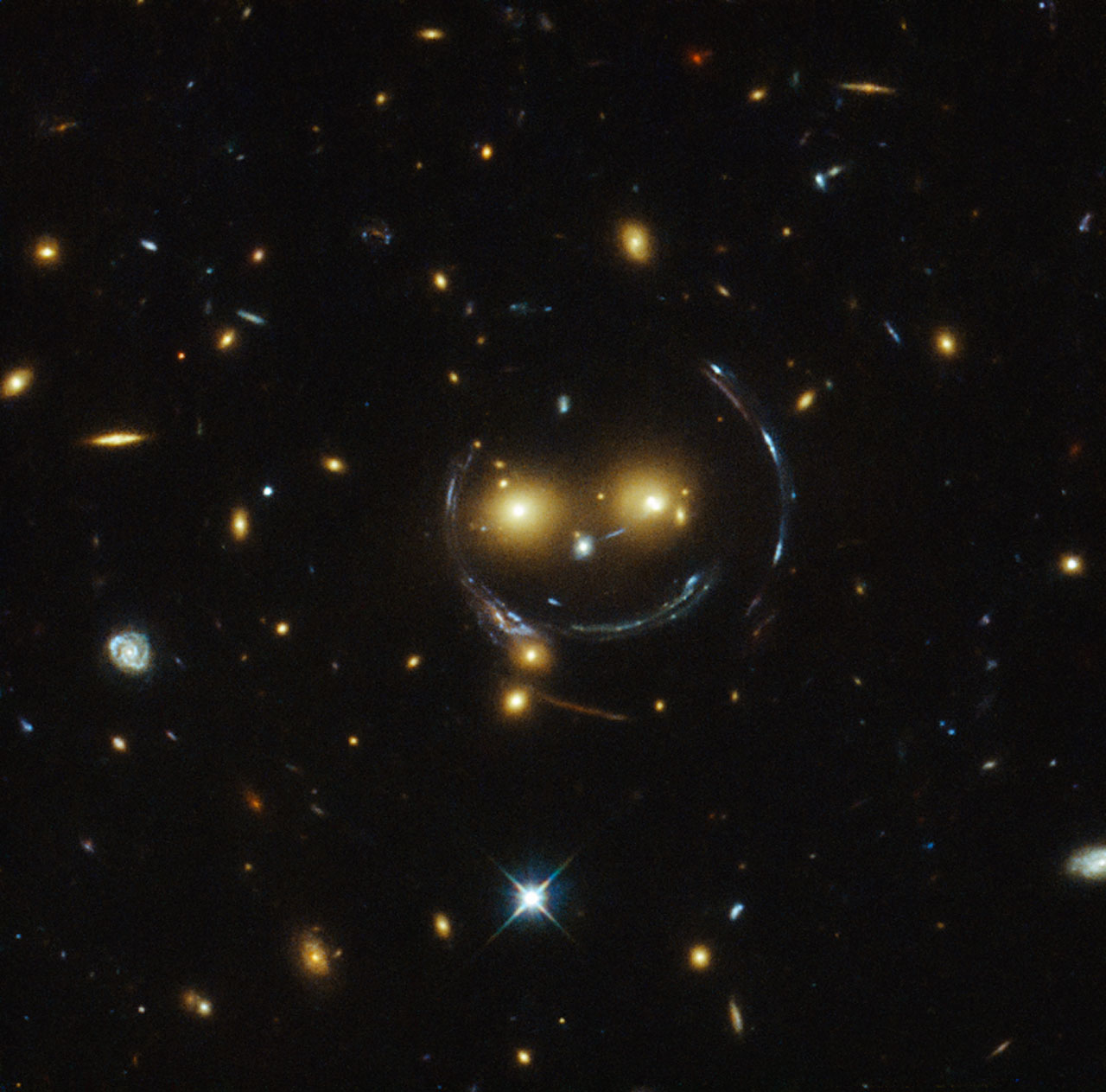 Gravitational lensing — light bending around a massive galaxy cluster, direct observational evidence of spacetime curvature