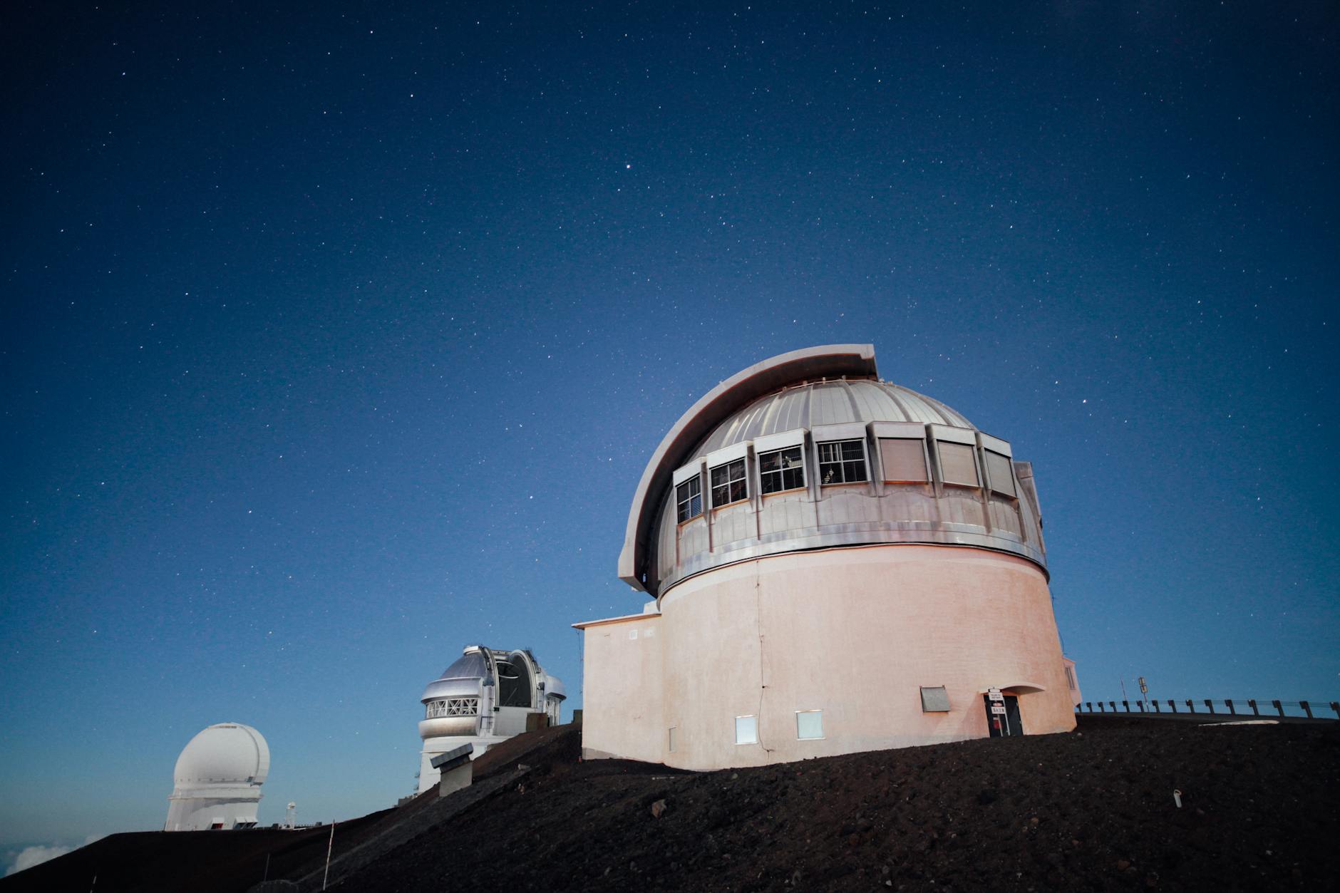 An observatory telescope collecting starlight for stellar spectroscopy.
