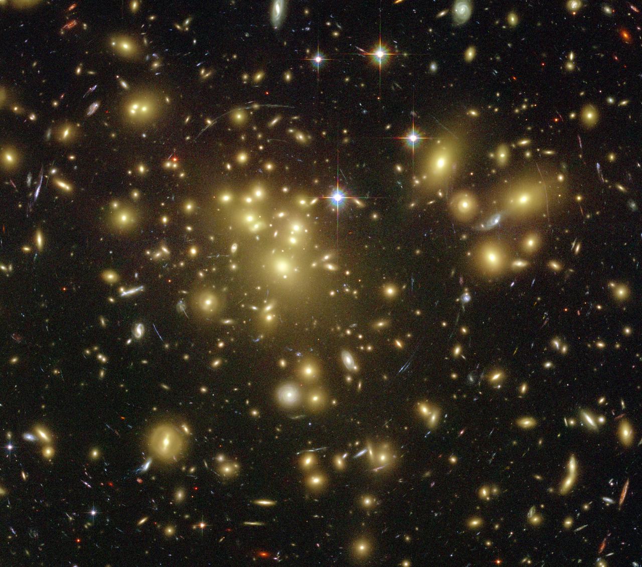 Galaxy cluster Abell 1689 with hundreds of galaxies and gravitational lensing arcs